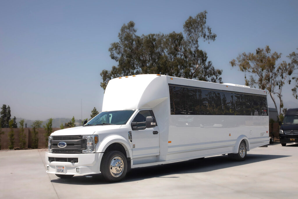 White Ford Bus for 30 passengers right side view